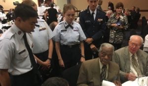 James Shipley, a Tuskegee Airman, autograph his biography for young teenage cadets at the 2017 Missouri ESGR Awards Dinner.